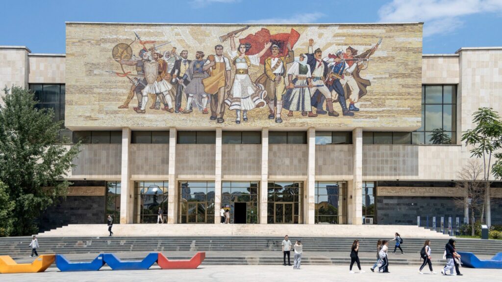 Museum building in Tirana with mural on the front.