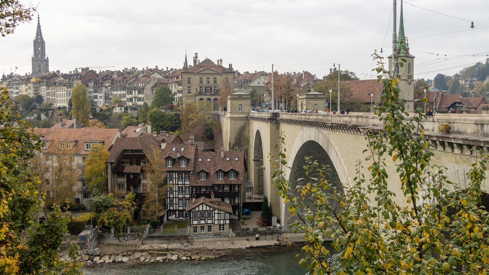 Historic bridge spanning river in Bern.