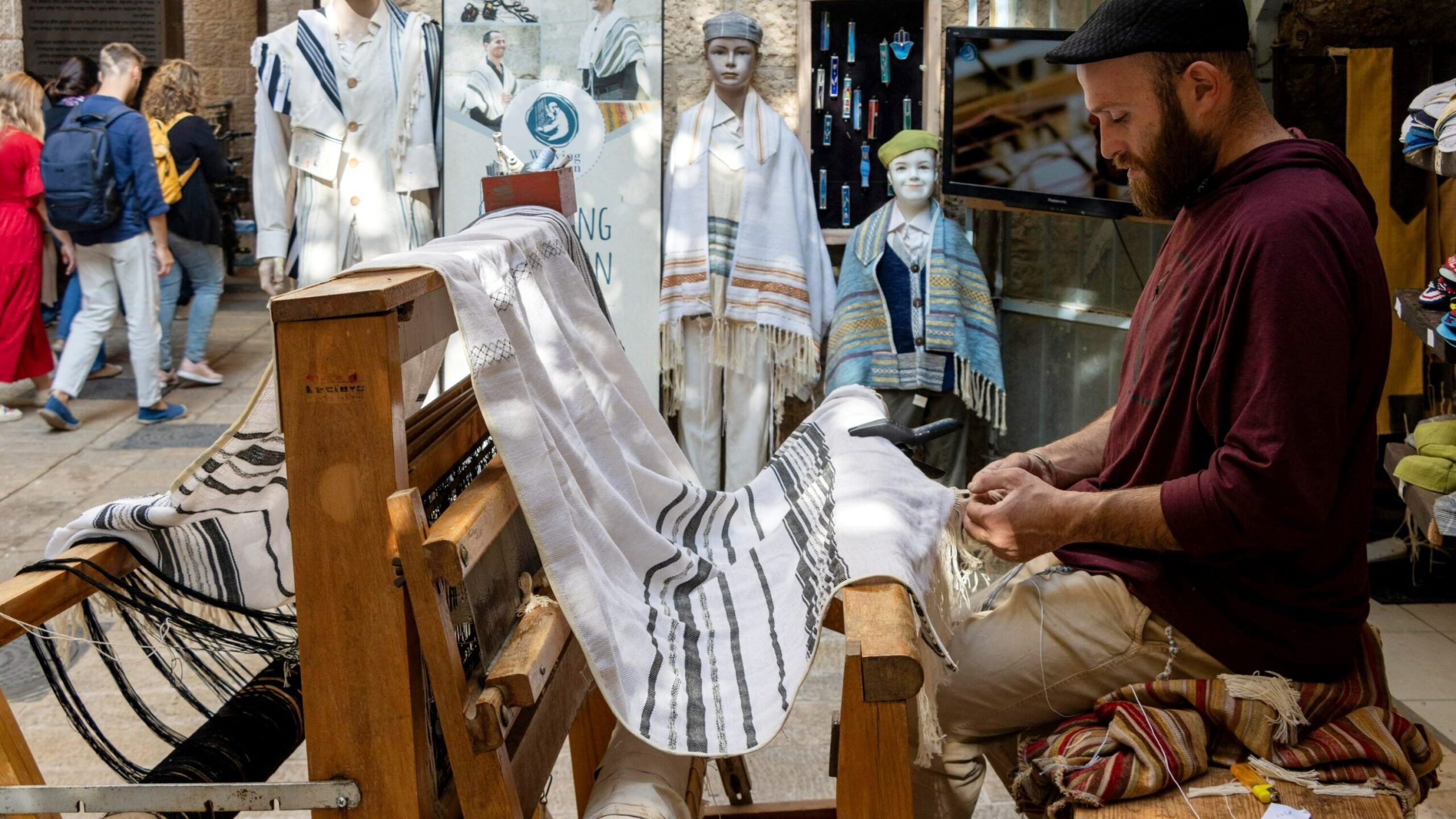 Man weaving cloth in Old City.