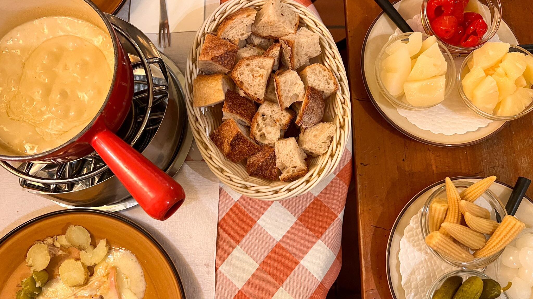 Selection of fondue and raclette in Swiss restaurant. 