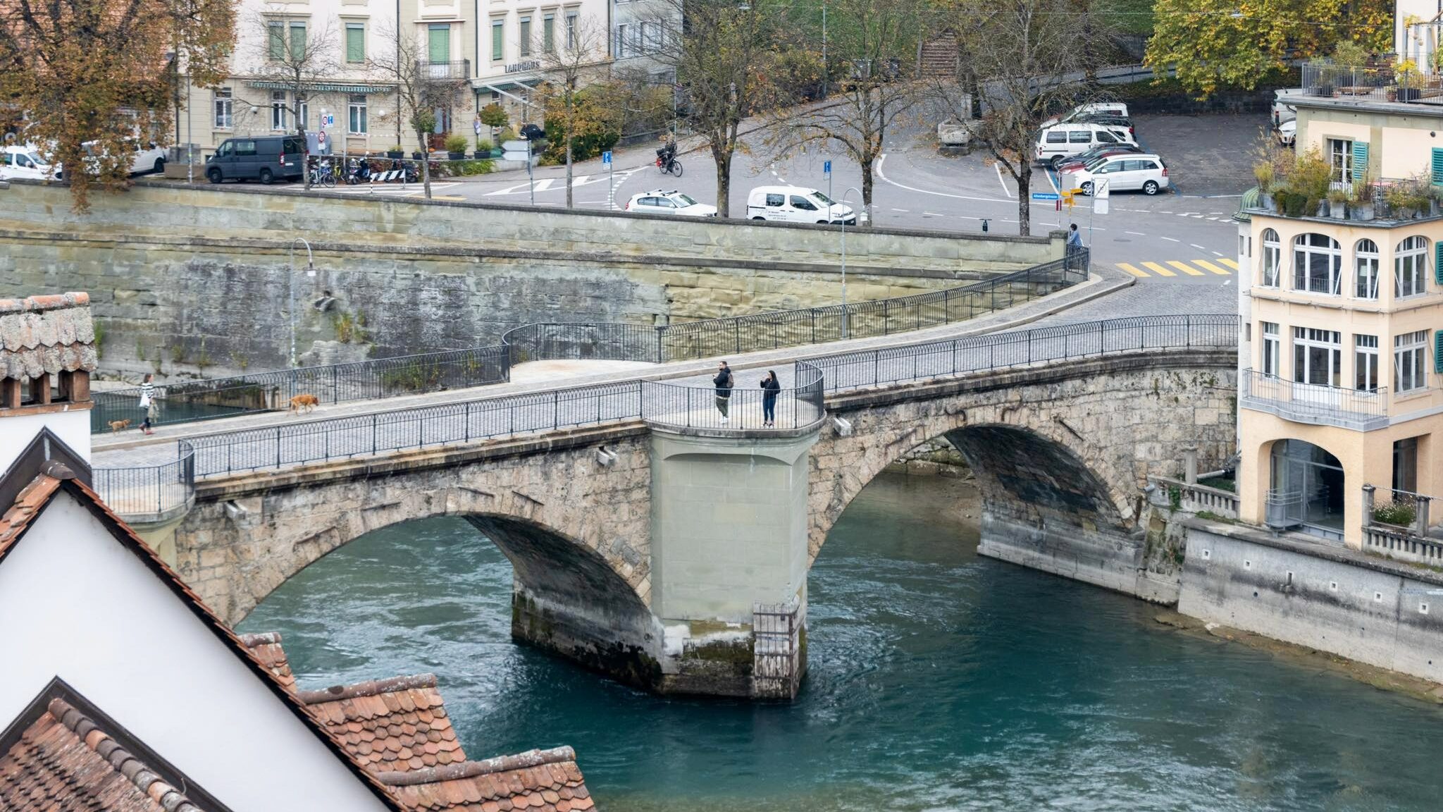 View of historic bridge crossing river in Bern.