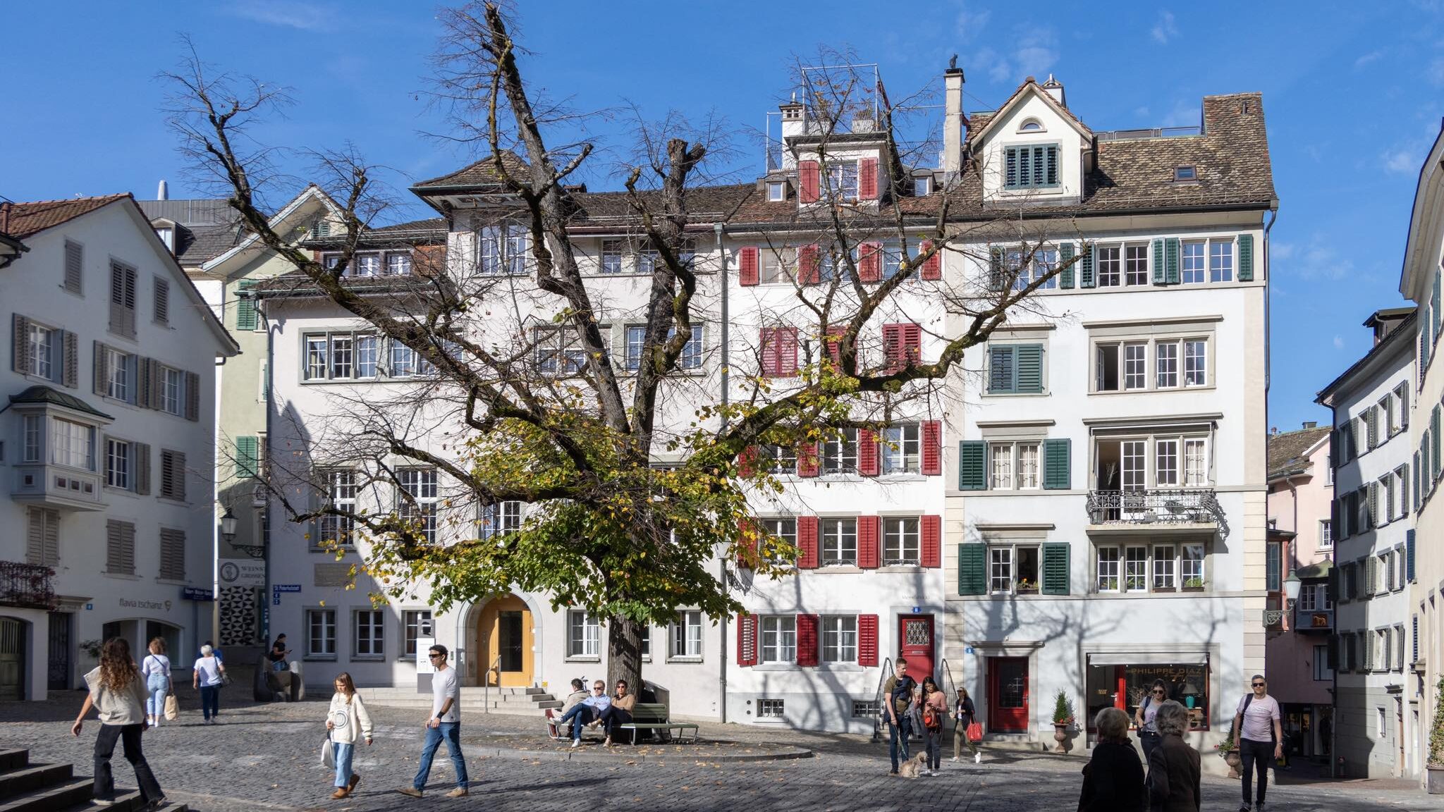 White buildings with colourful window frames.