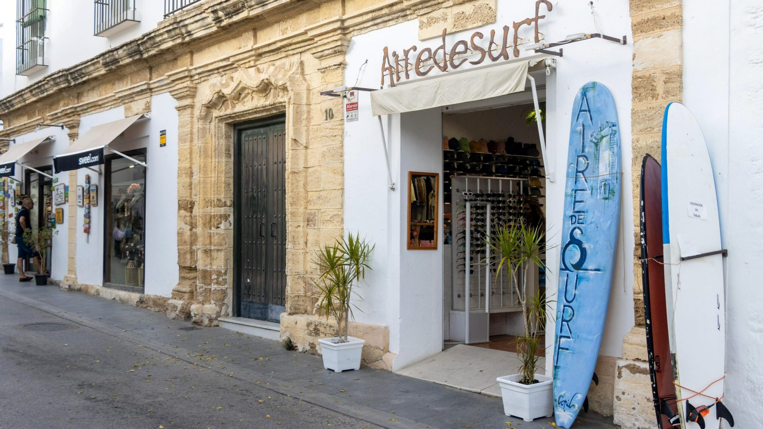 Street in Conil with surf shop.