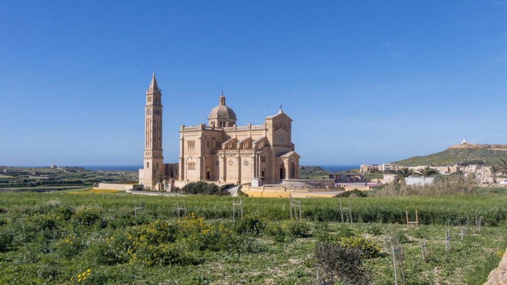 Large religious shrine in a field.