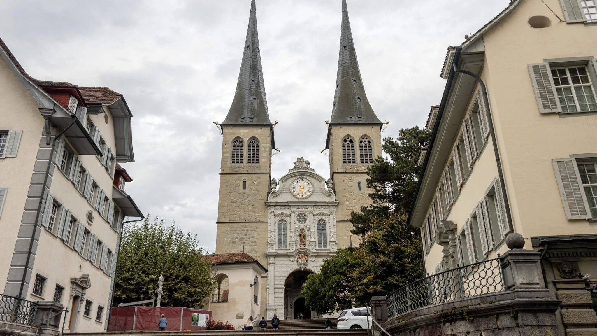 Church with two spires at the top of steps.