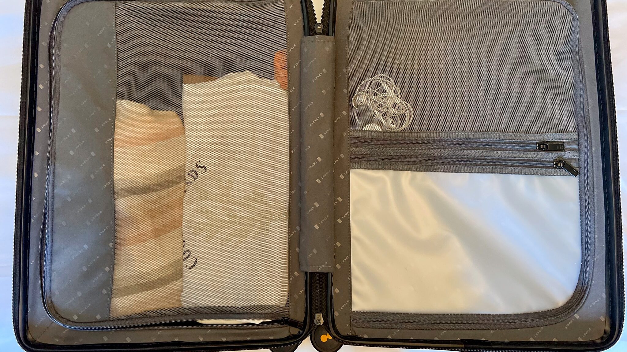 Compartments inside carry-on suitcase. 