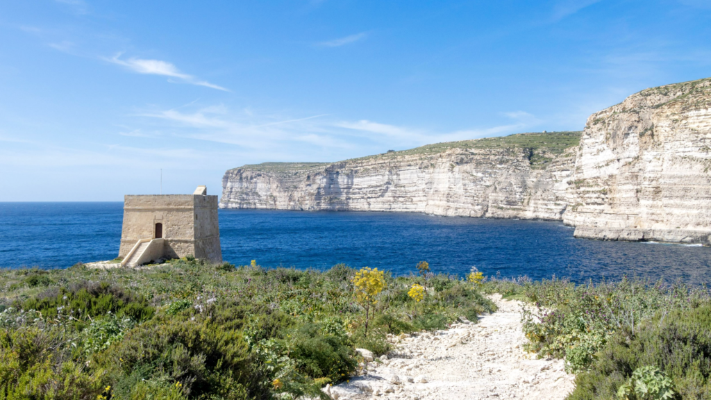 View of blue water and old watch tower.