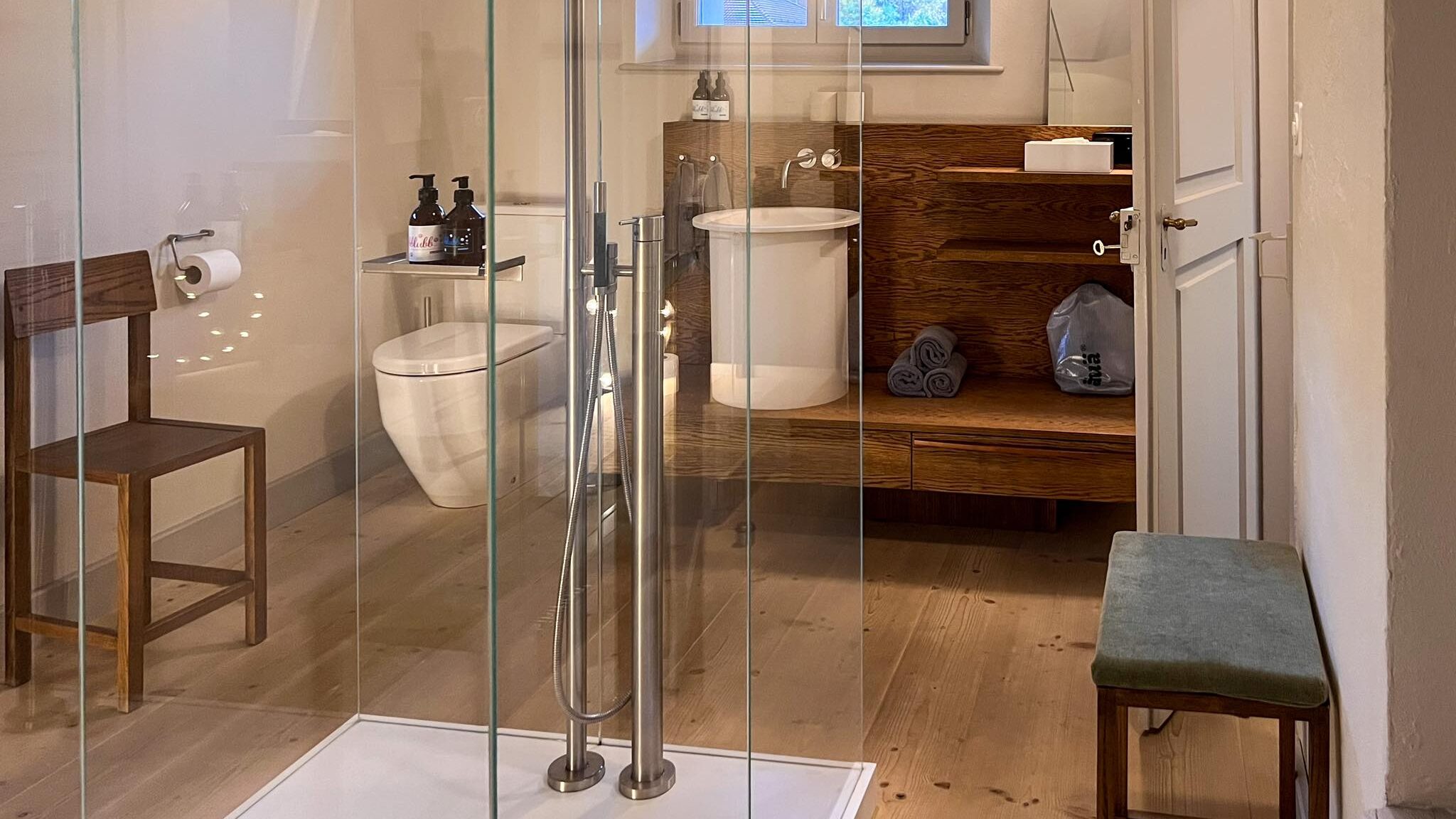 Large bathroom with glass walk-in shower.