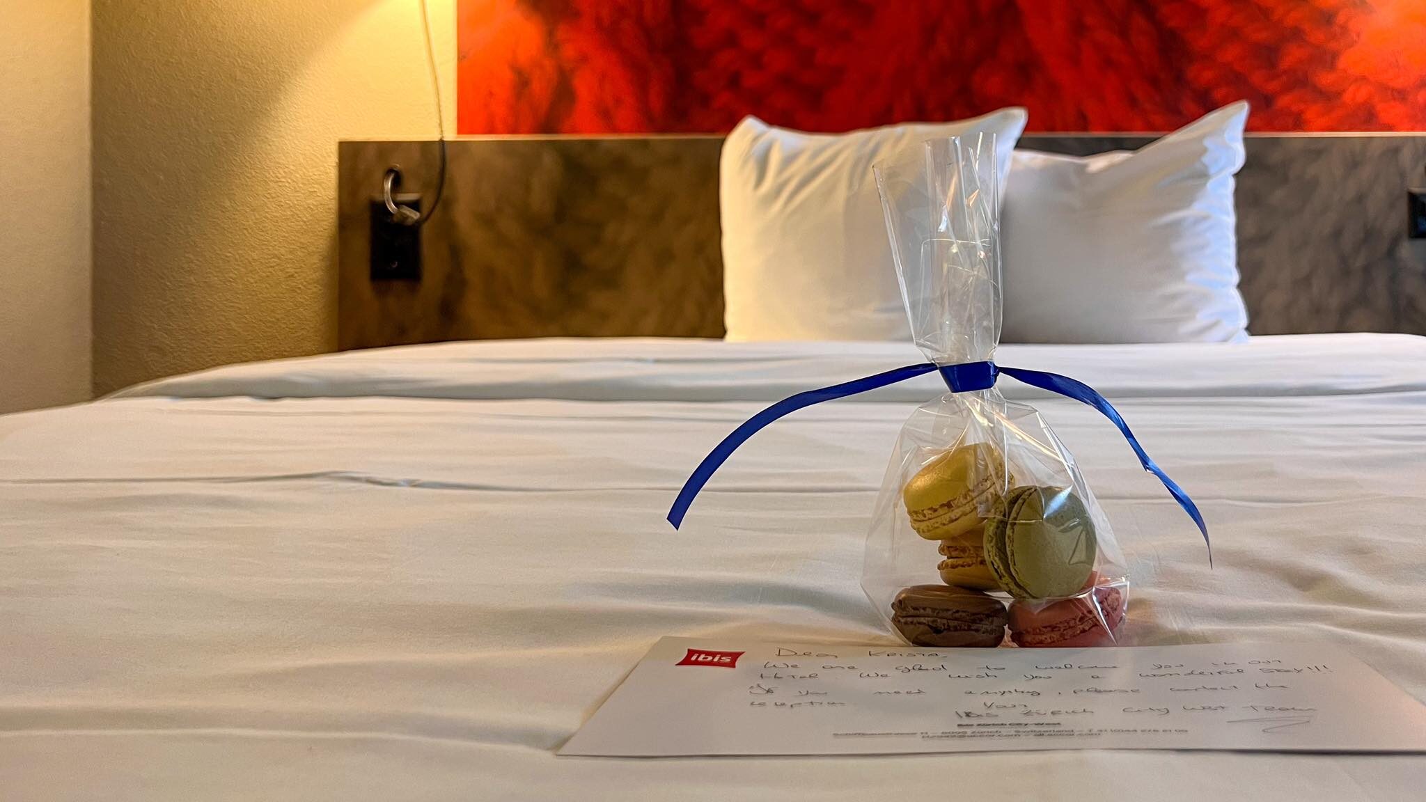 Double bed with macaroons in plastic.