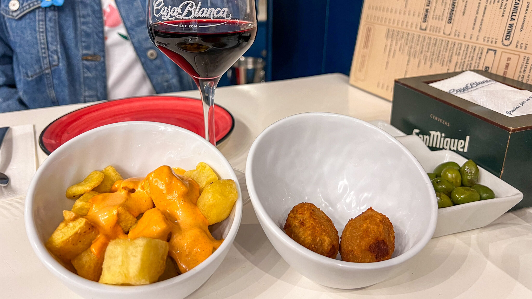 Tapas dishes of patatas bravas and croquettes. 