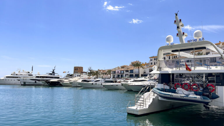 Expensive port area in Marbella with boats.