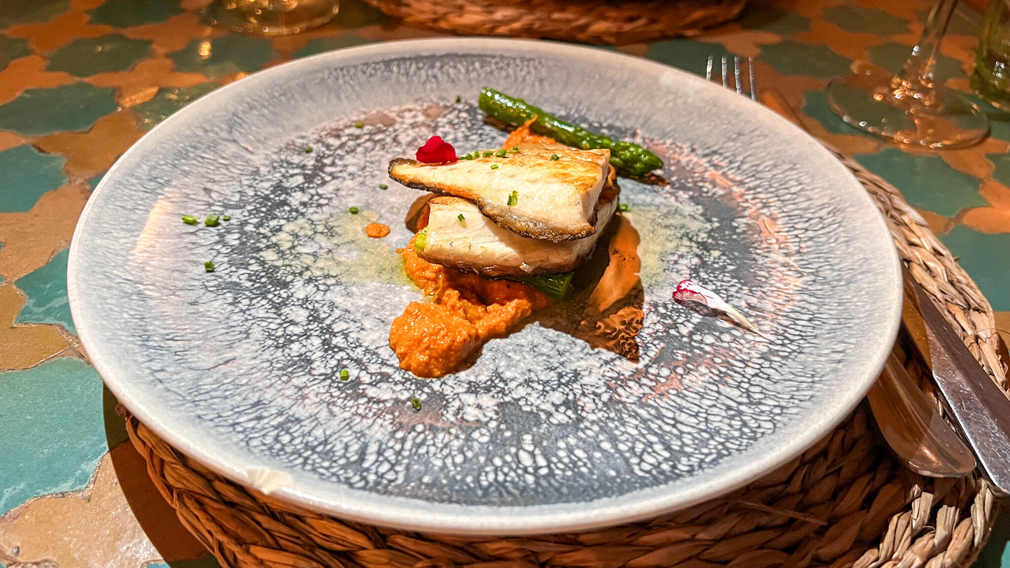 Small dish of white fish with seasonal vegetables. 