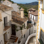 Narrow street in Sedella with steps.