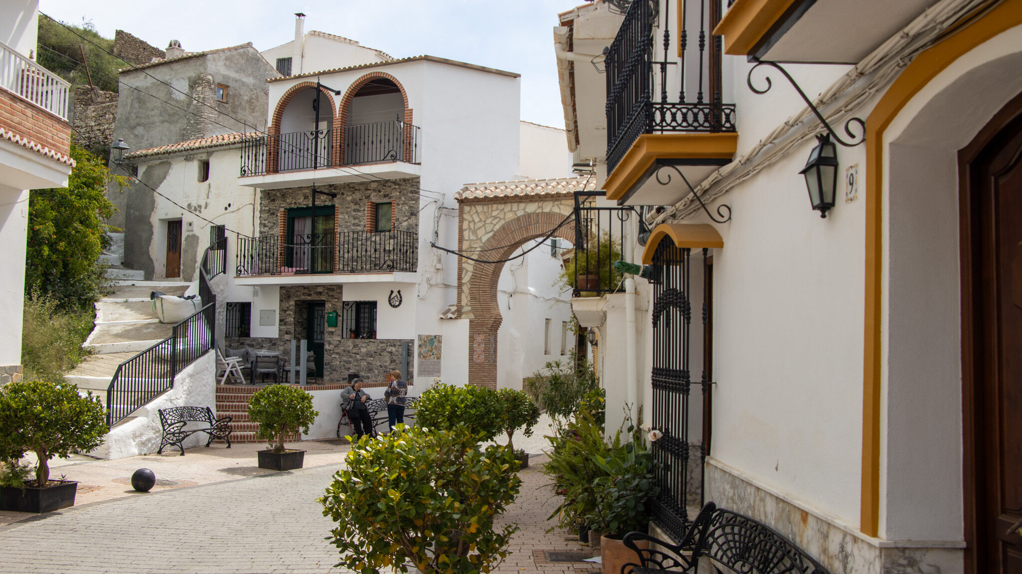 Small Arab arch entrance in white village.