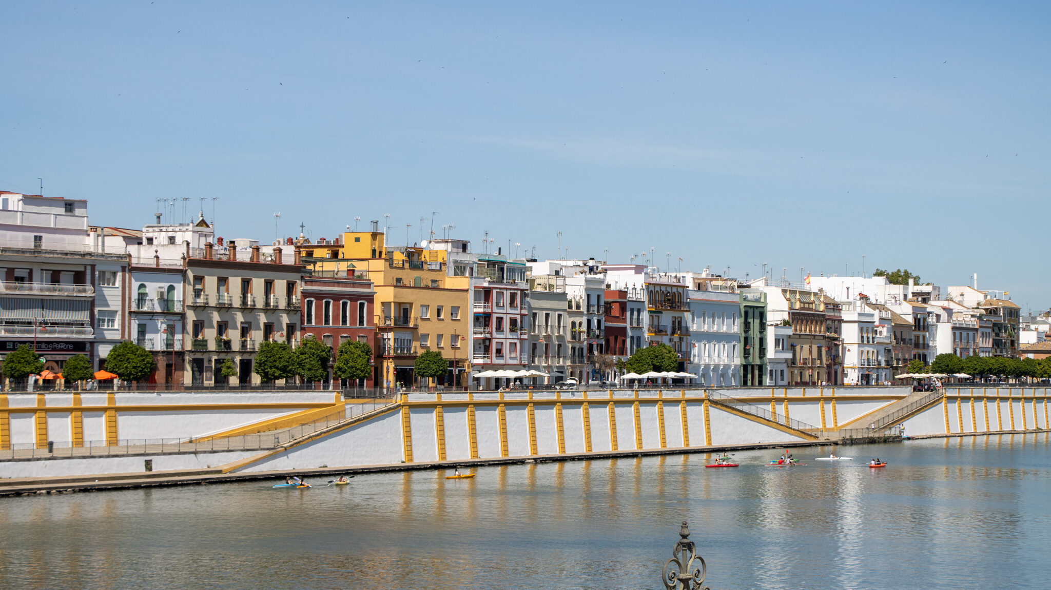 Colourful buildings across the river in Sevilla.