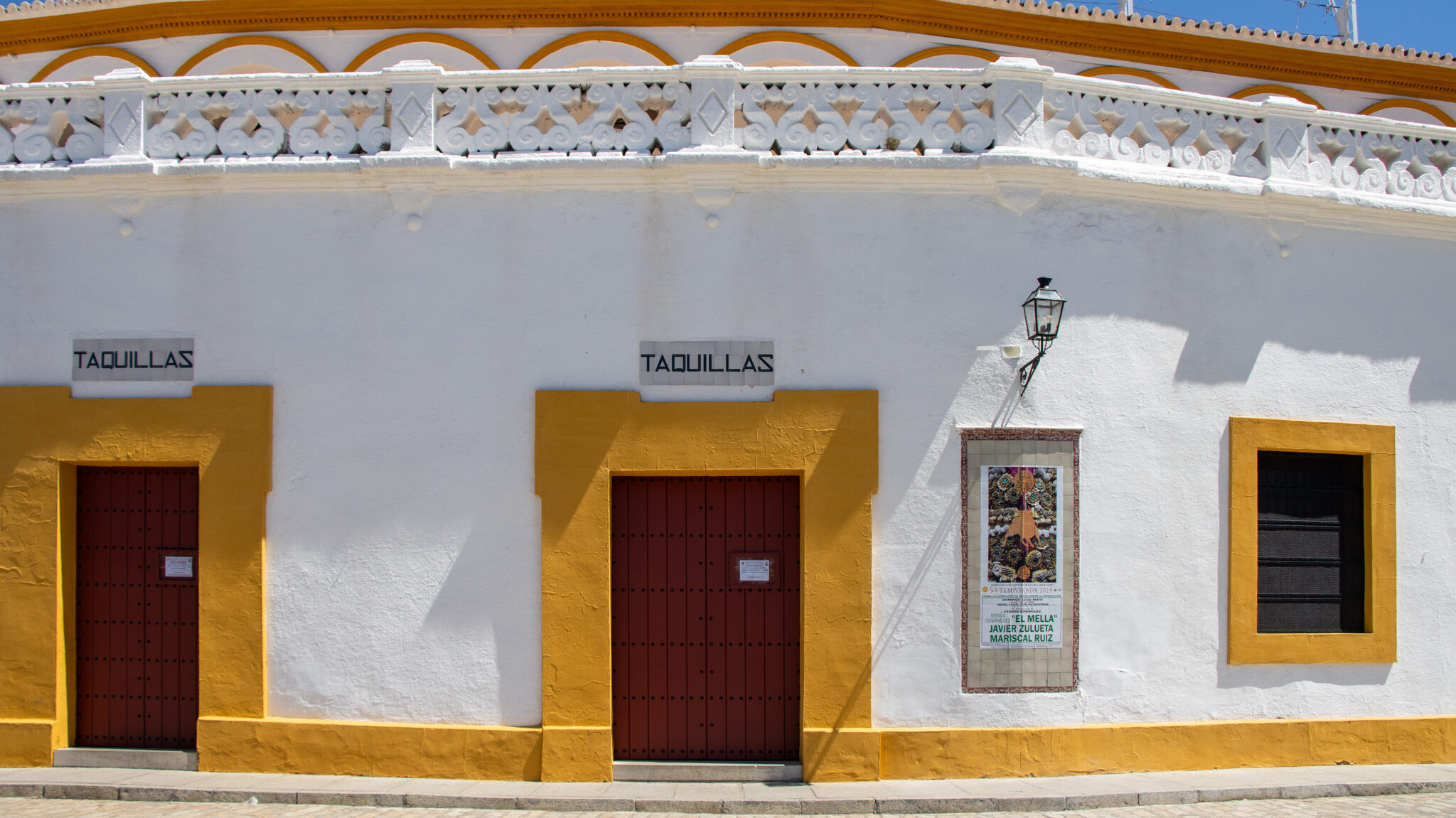 Outside bullring in Sevilla painted white and yellow.