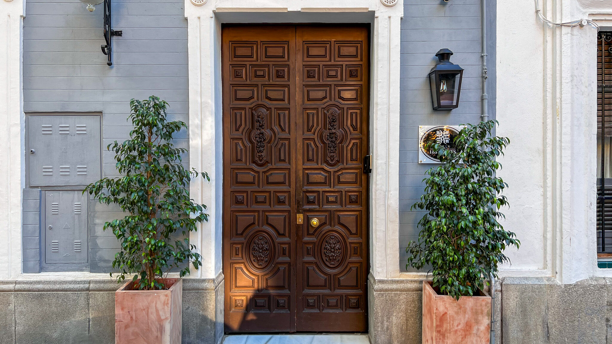 Wooden door leading to historic apartments 2 days in Seville.