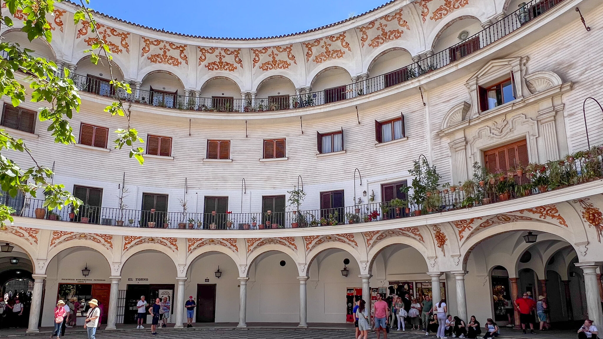 Plaza in Sevilla with round building. 