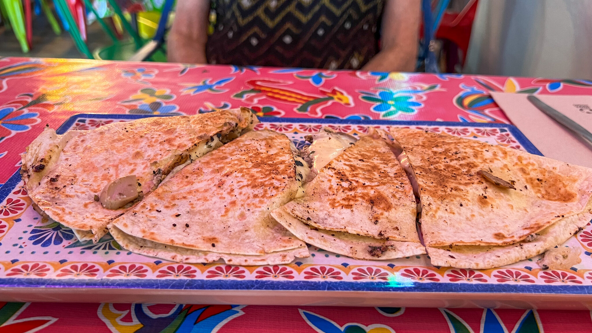 Plate in Mexican restaurant with quesadilla. 