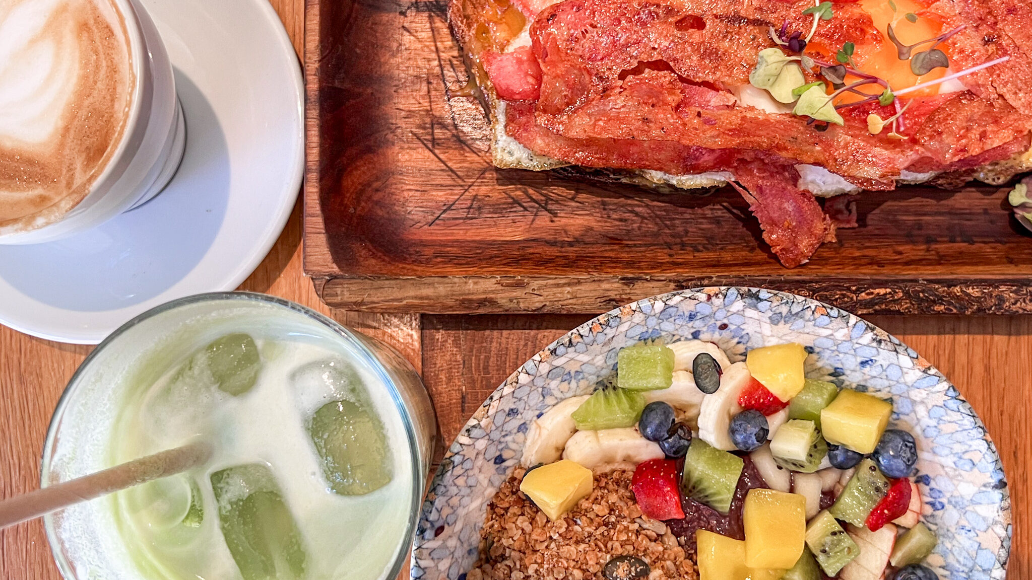 Acai bowl with matcha latte and avocado toast.