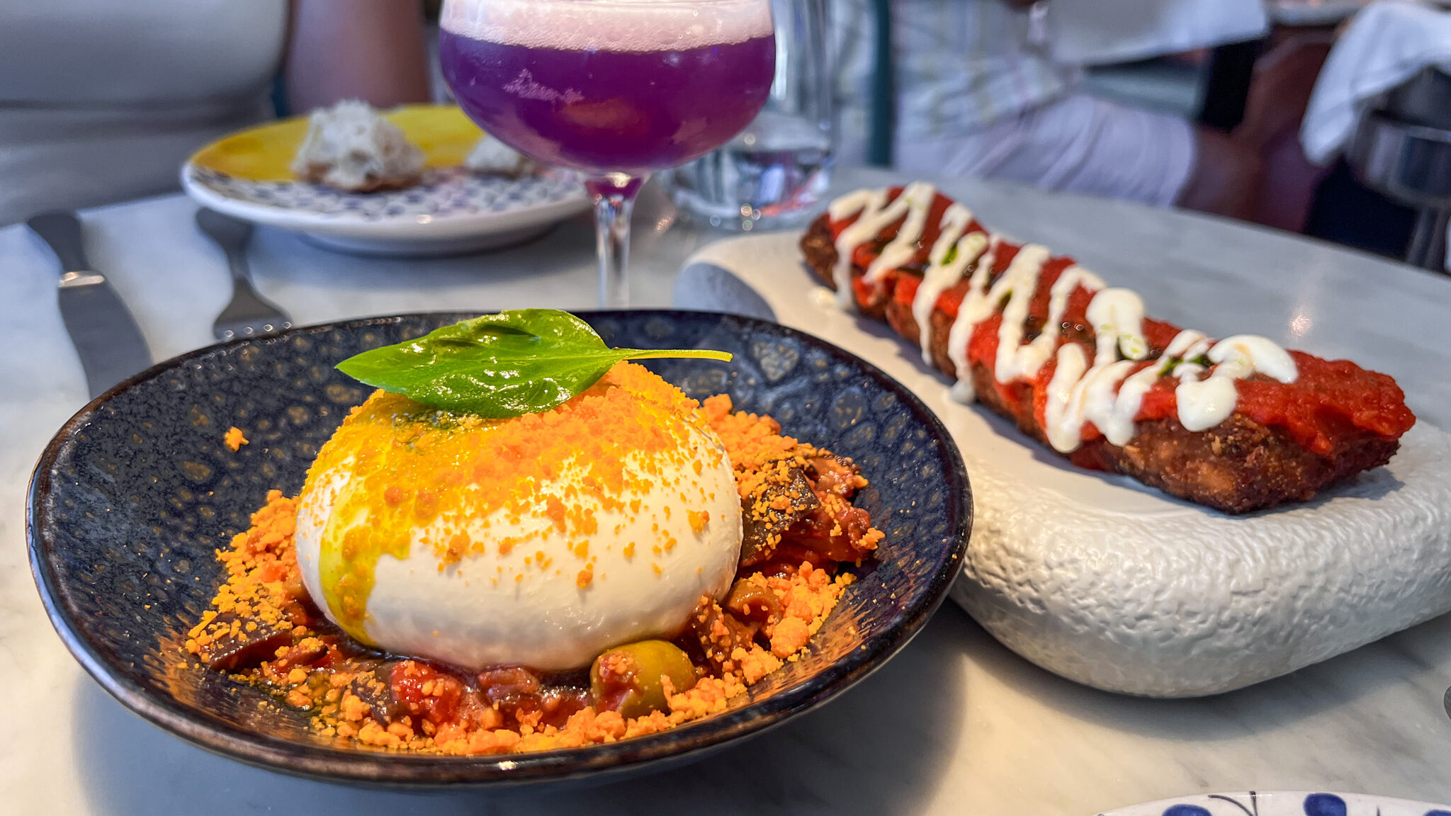 Burrata dish and aubergine croquette with cocktail.