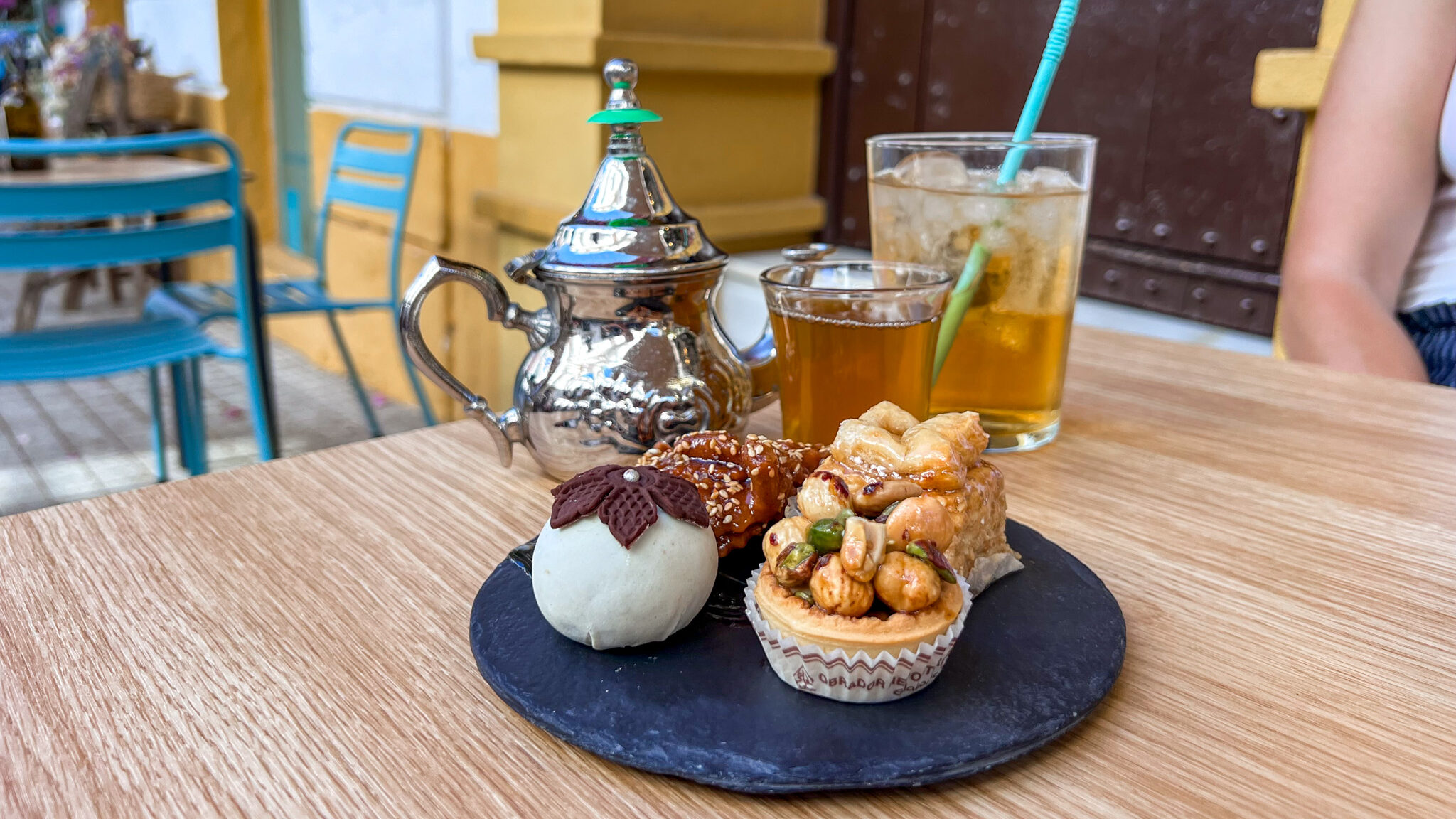 Moroccan teas and sweet treats on table.