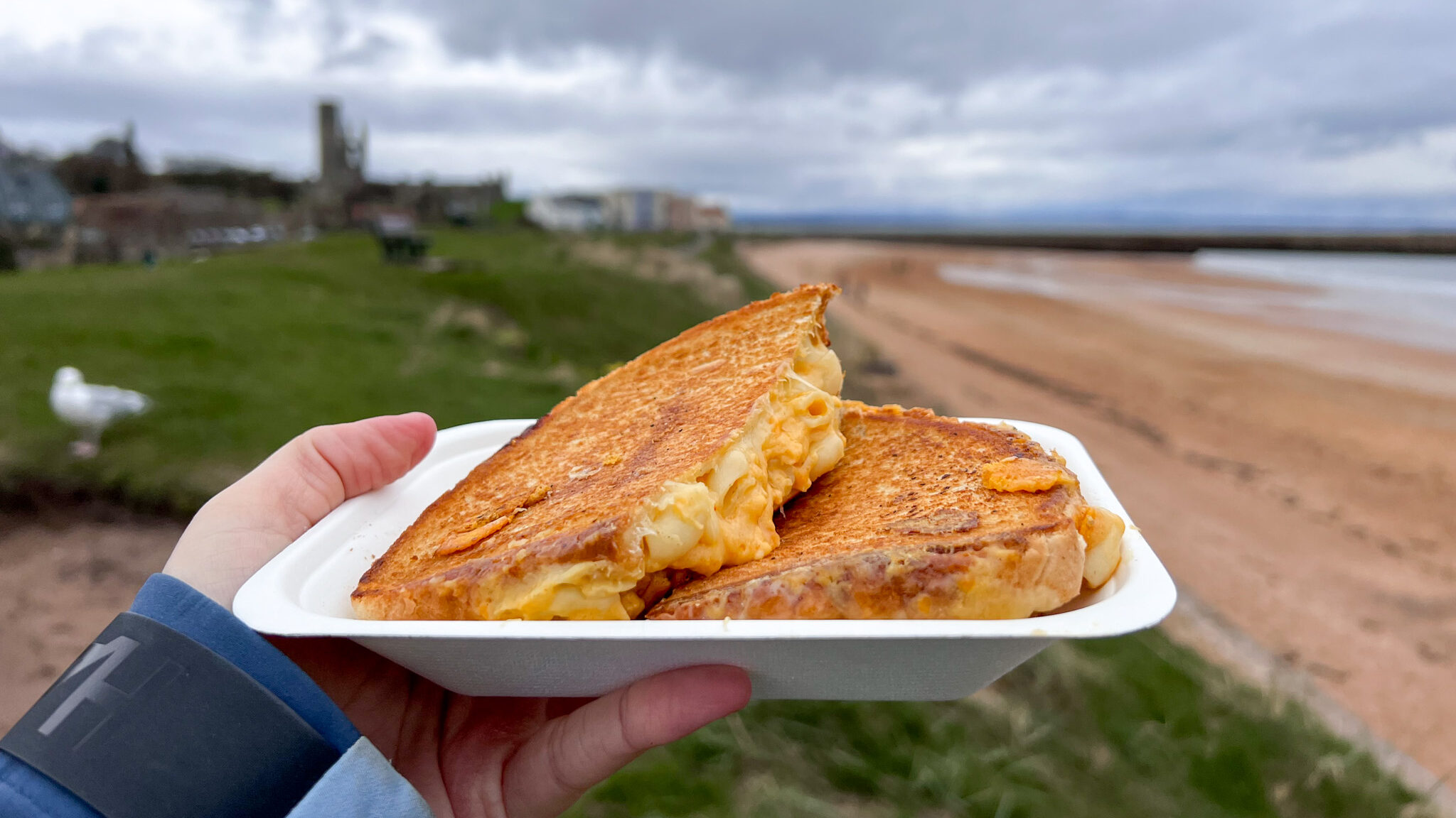 Mac n' cheese toastie at beach.