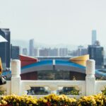 Girl with umbrella looking at Shenzhen.