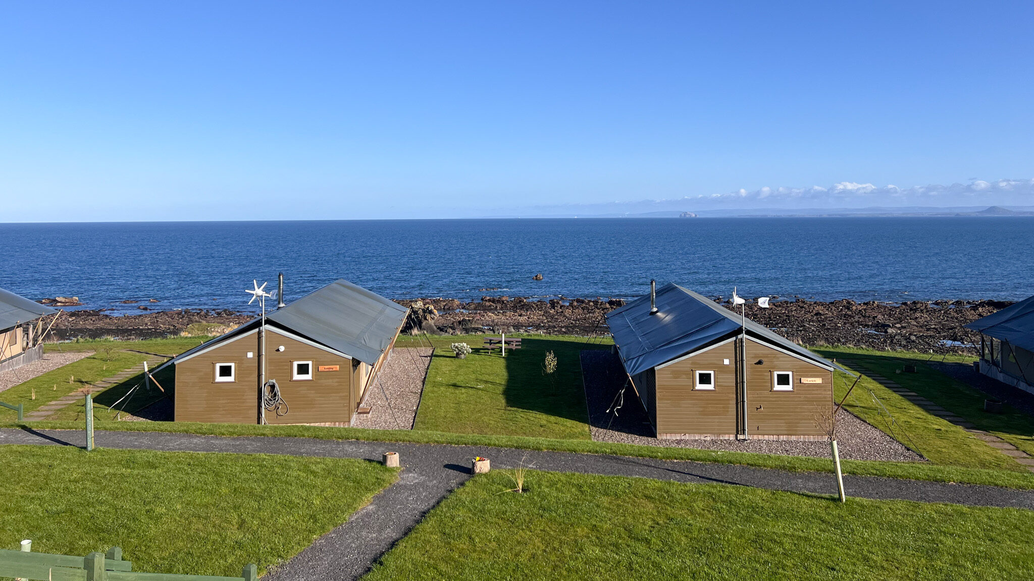 Row of safari lodges along waterfront in Fife.