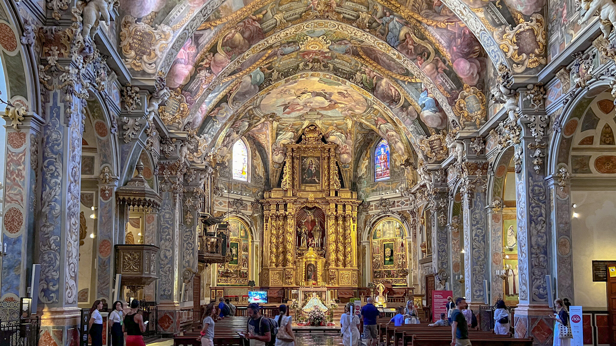 Interior of church in Valencia with painted ceiling.