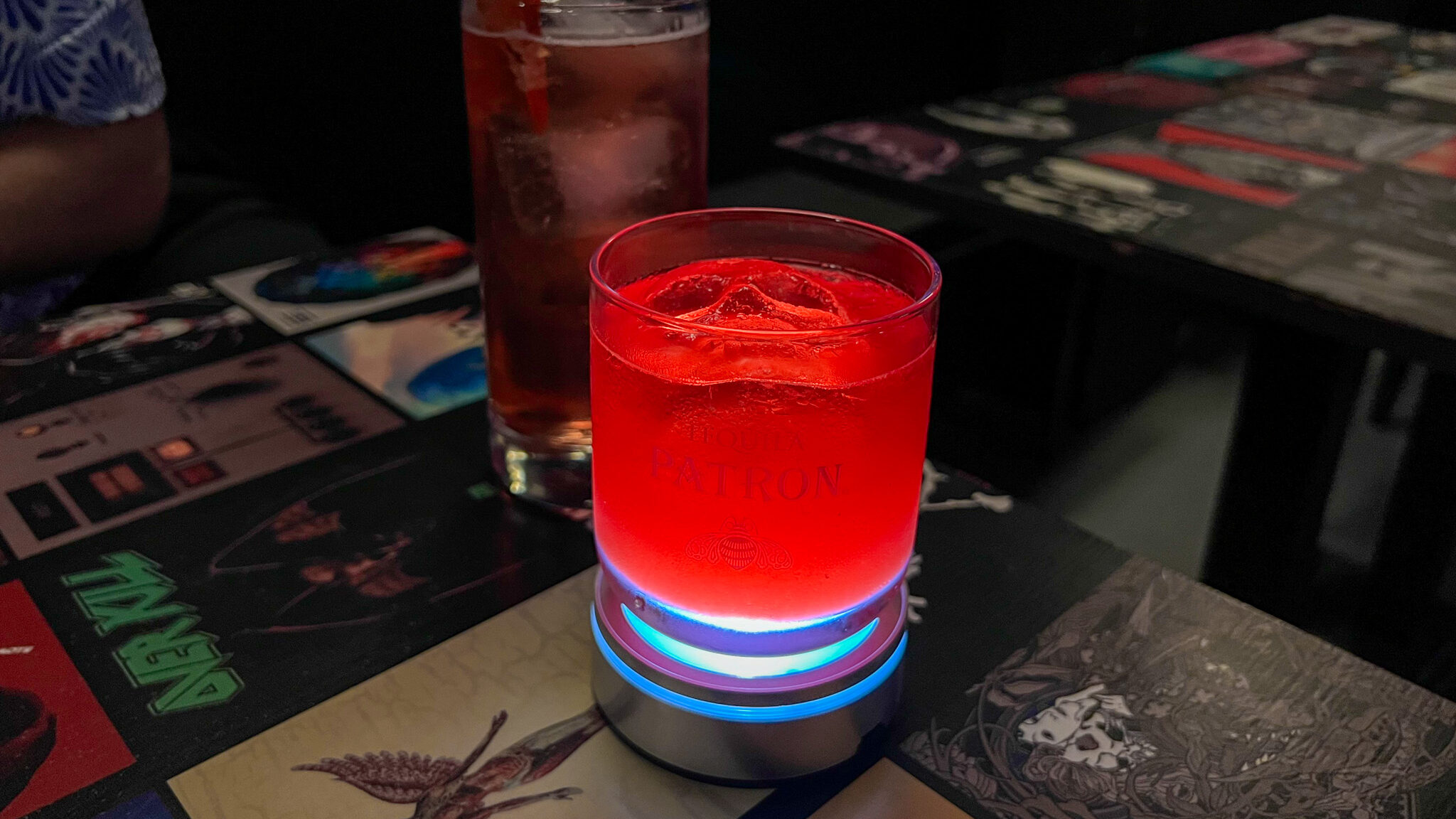 Bright red cocktail with skull ice cube.