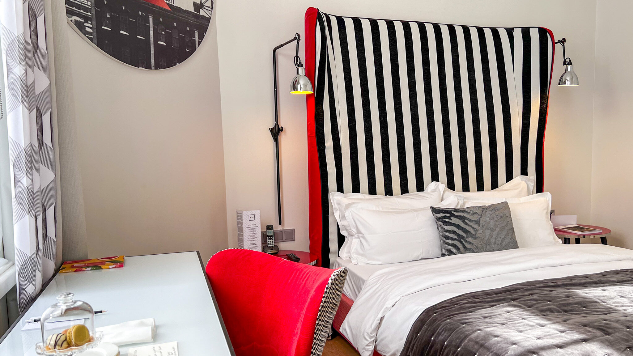 Large bed decorated in modern stripes. 