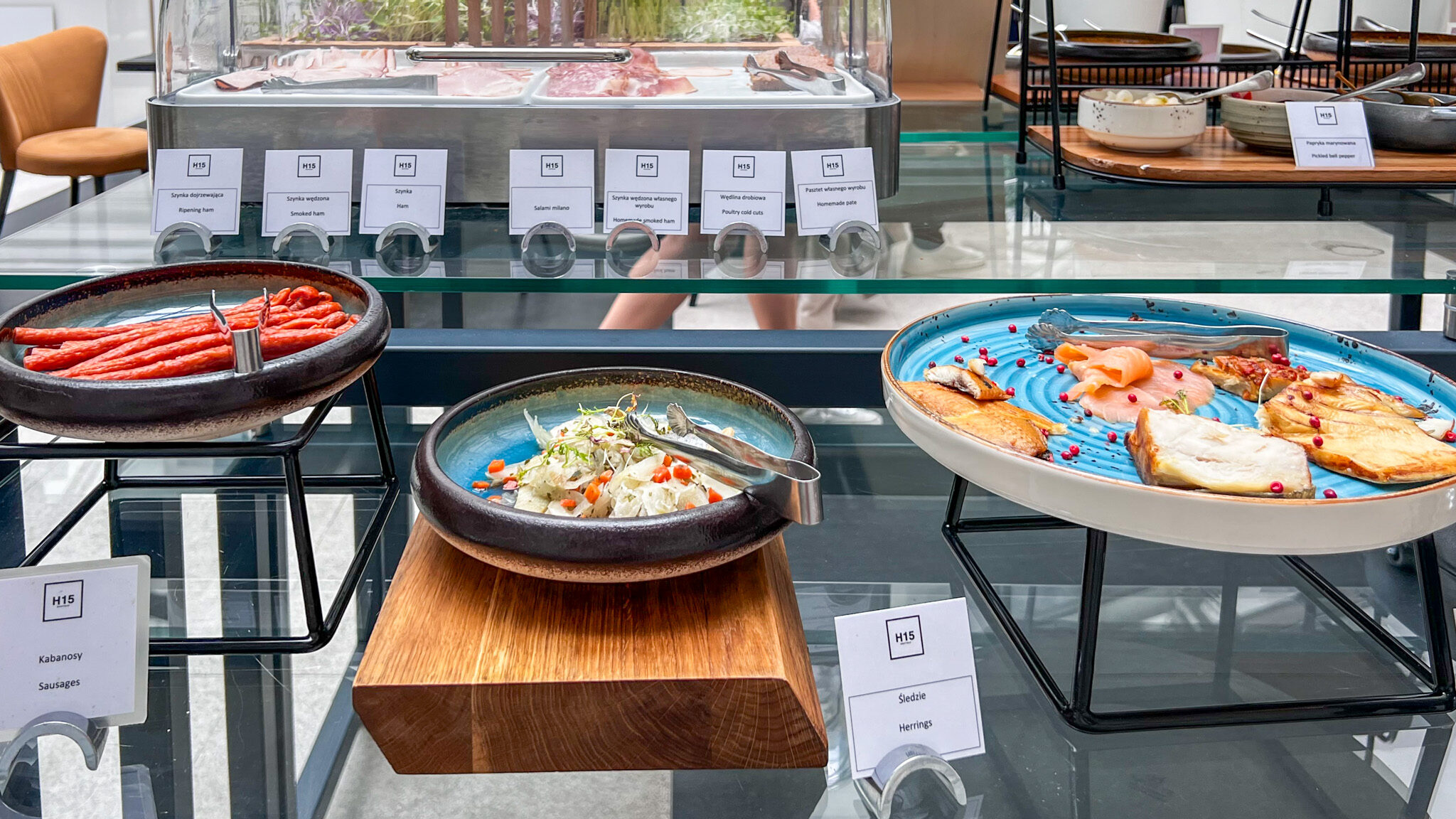 Selection of breakfast foods at hotel buffet.