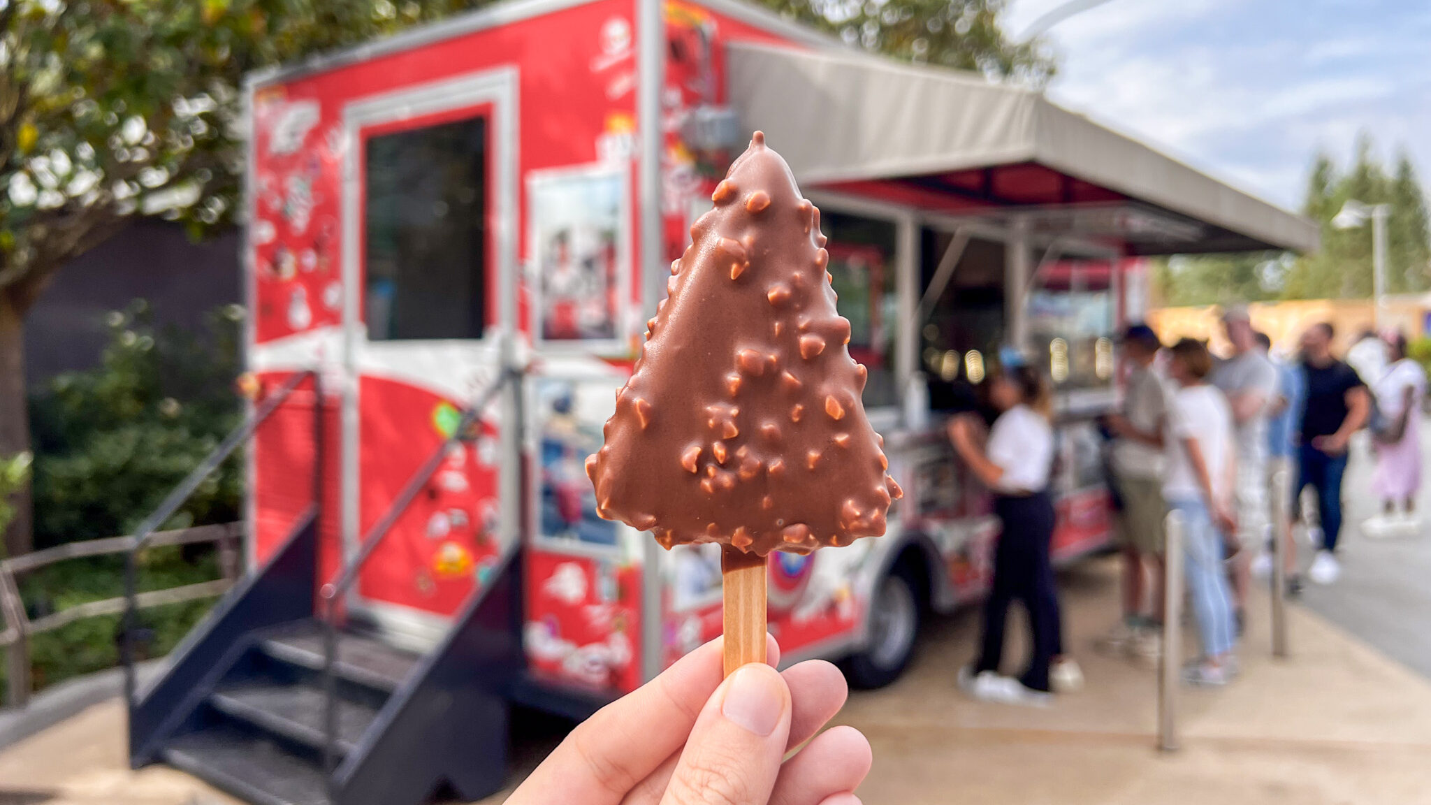 Cheesecake on a stick covered in chocolate.