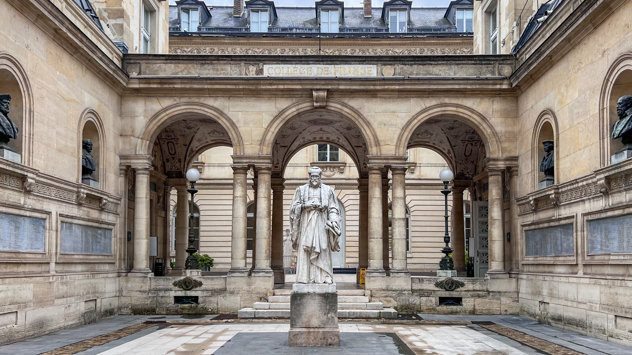 Small courtyard with statue in the middle.