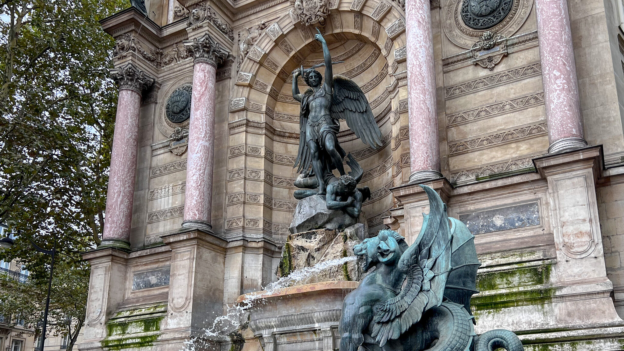 Historic water fountain with statues.