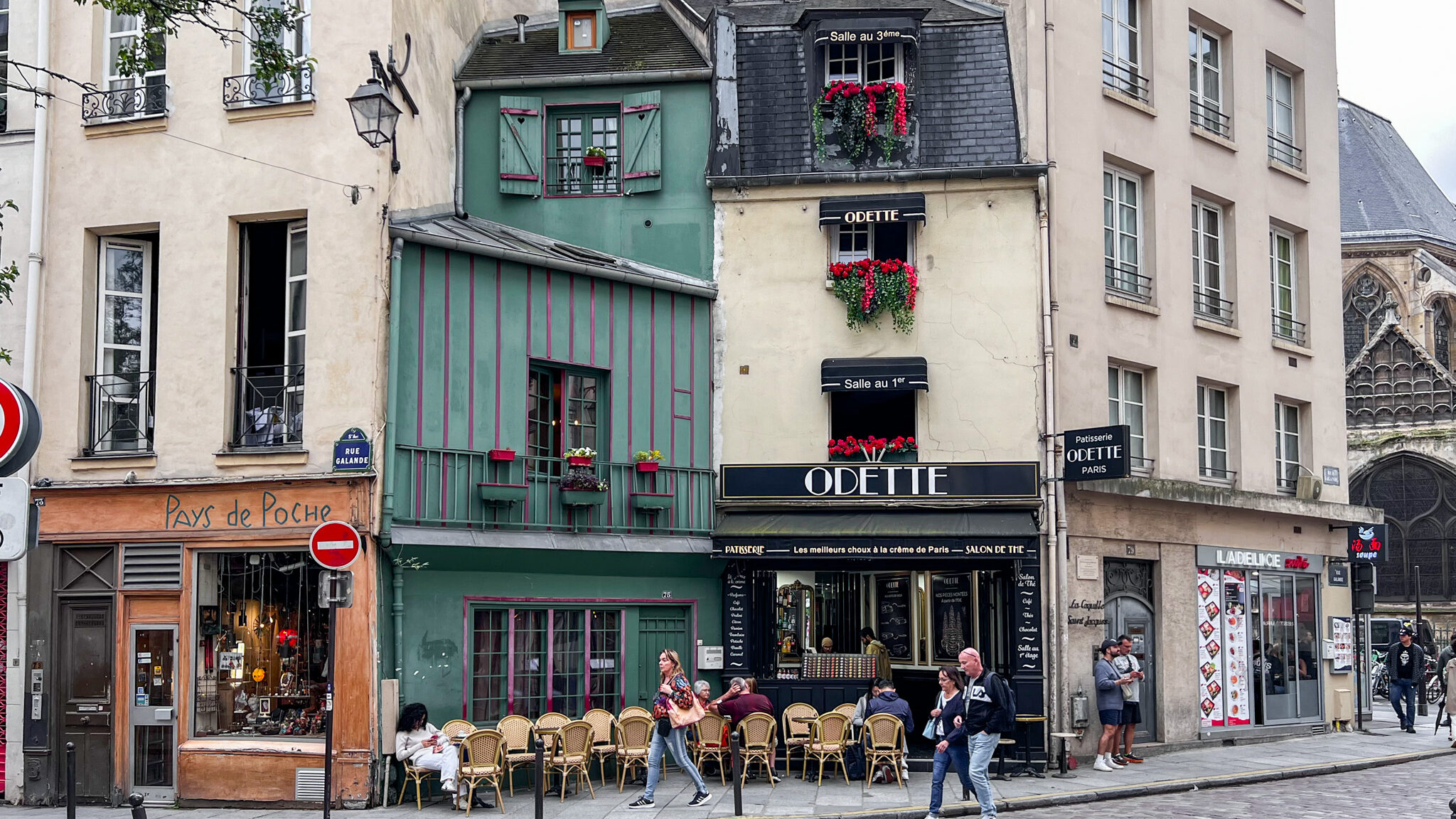 Historic street in Paris with old shopfronts. 