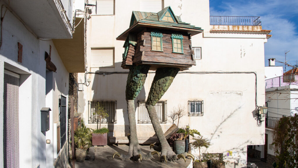 House of a witch on stilts that look like legs.