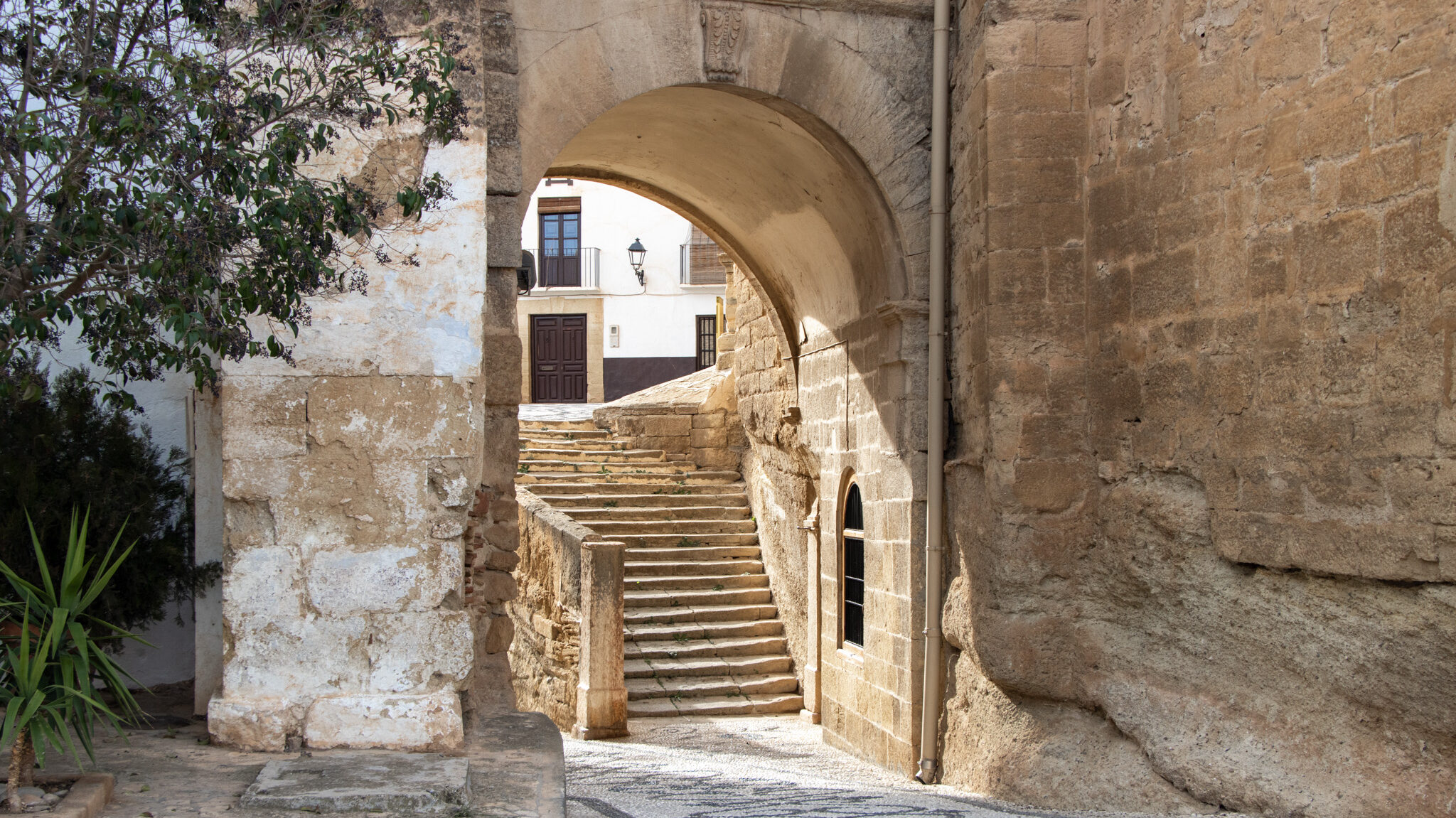 Historic stone arch in village next to church.