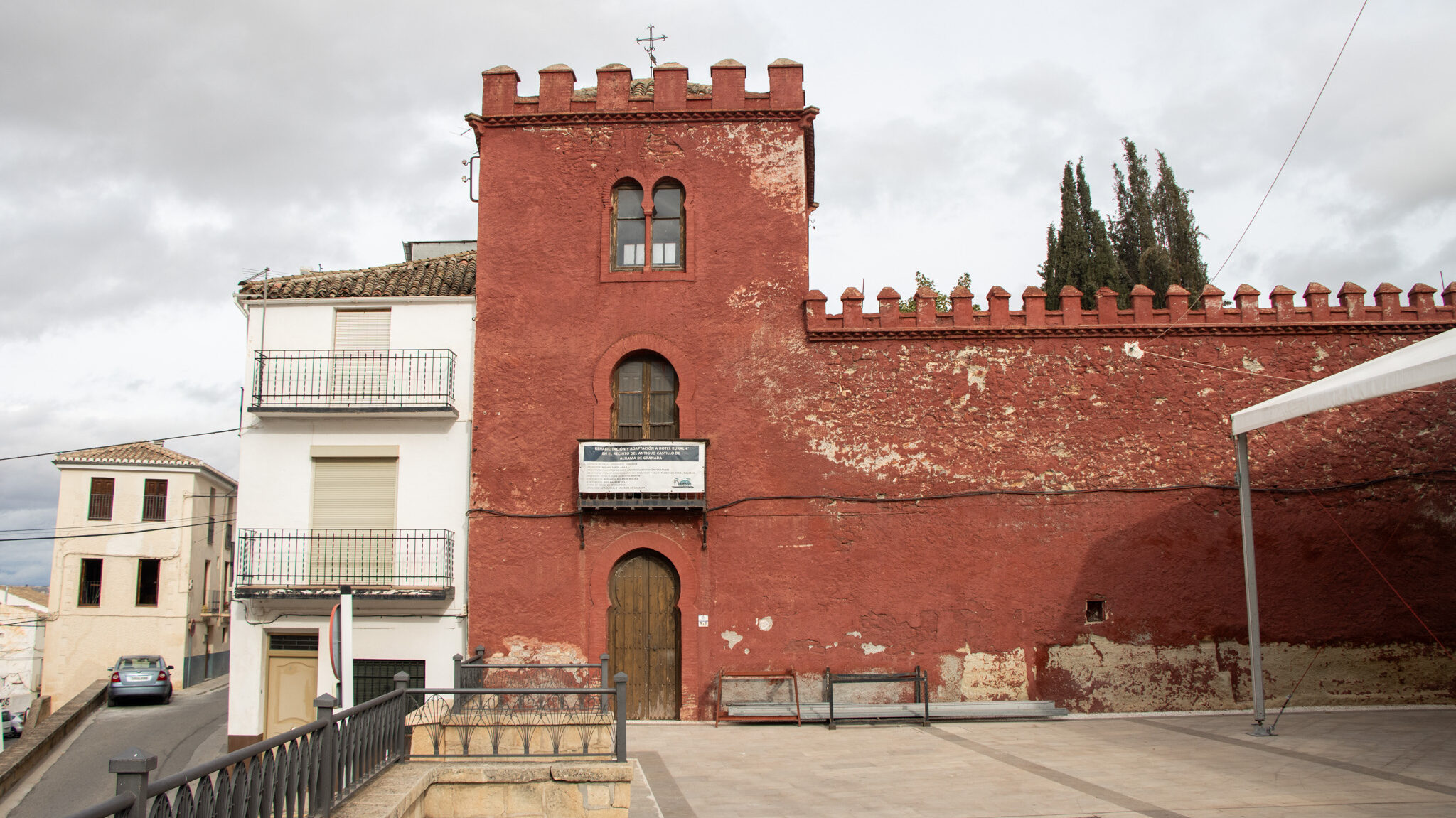 Castle painted in red with small tower.