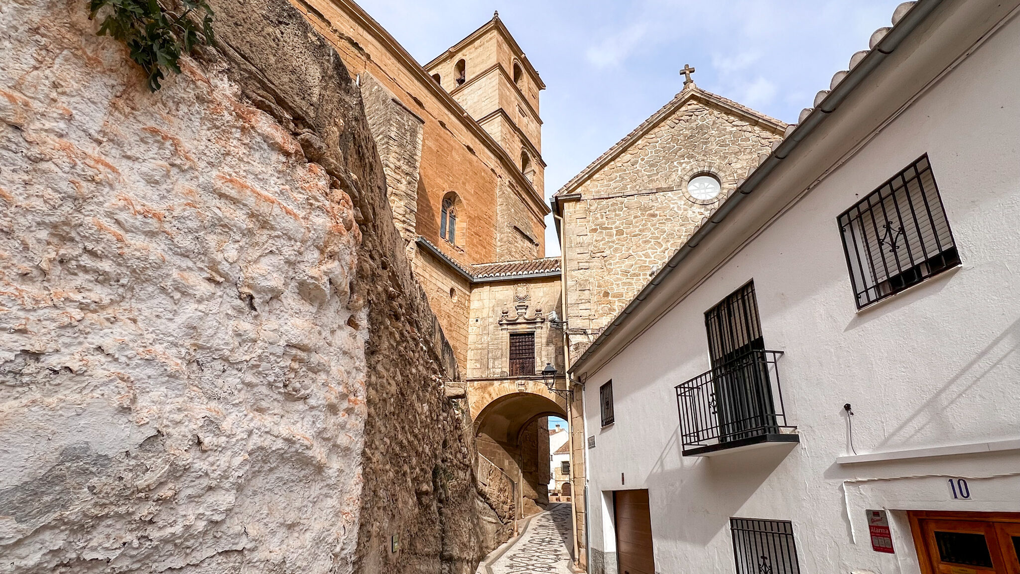 Narrow street leading to church in Alhama de Granada.