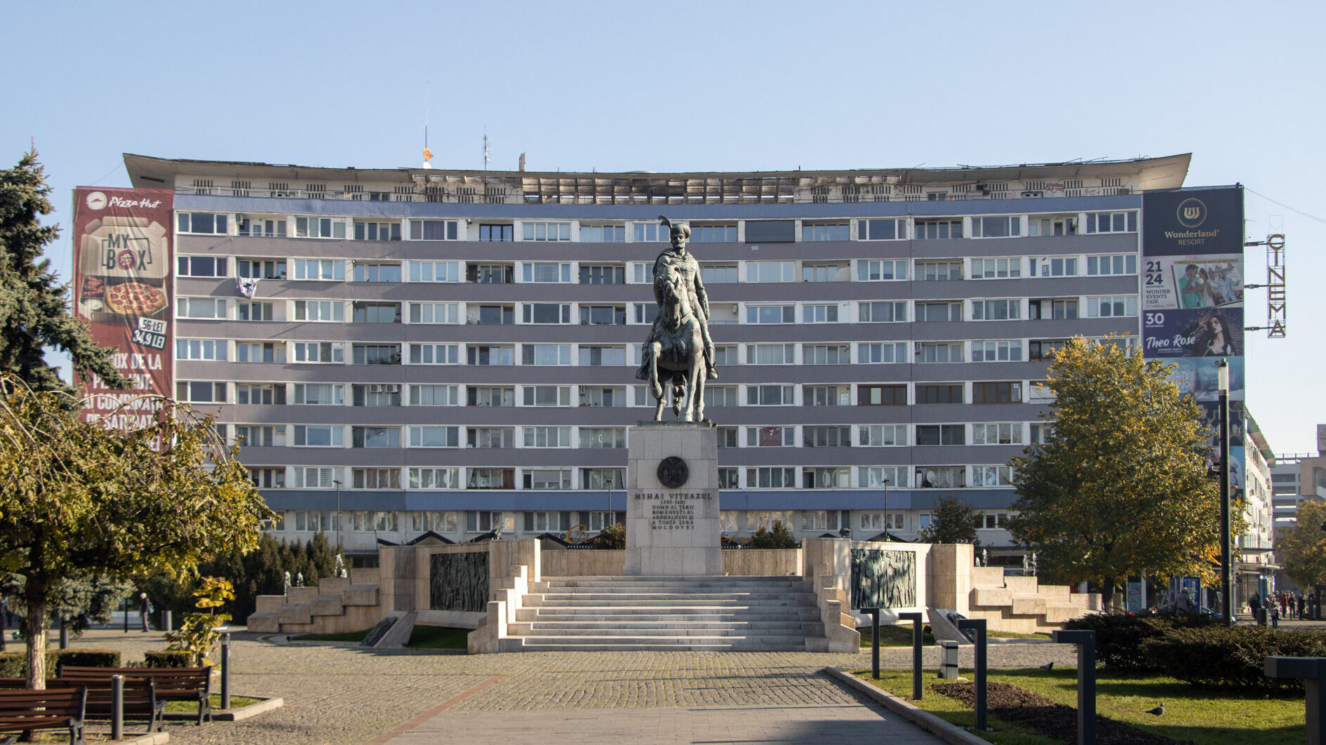 Small square with statue of man on horse.