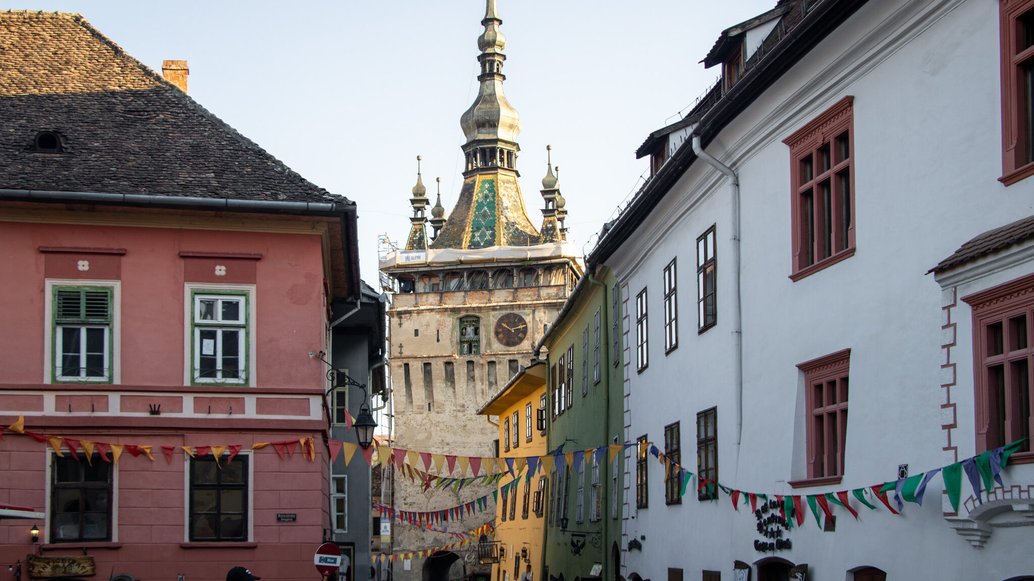 Sighisoara Romania | Krista the Explorer View of bell tower between medieval houses.