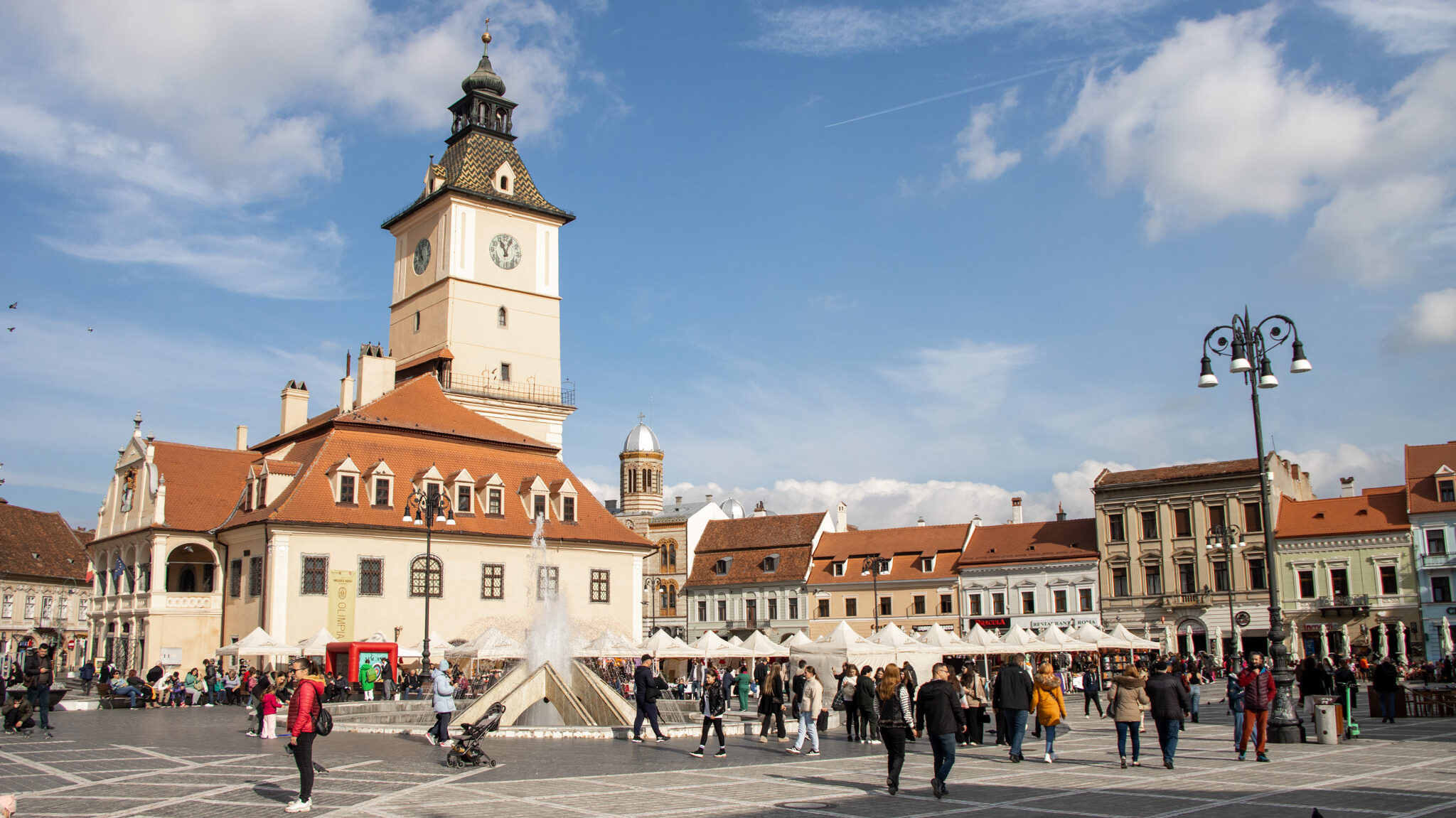 Main square in Brasov with council tower in centre.