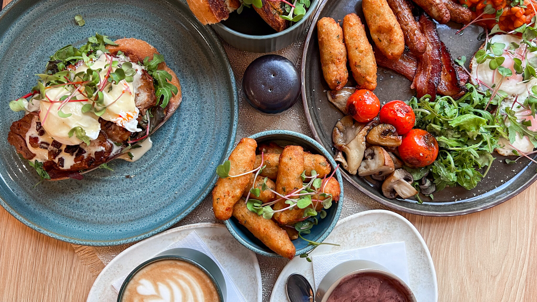 Selection of breakfast dishes in cafe.