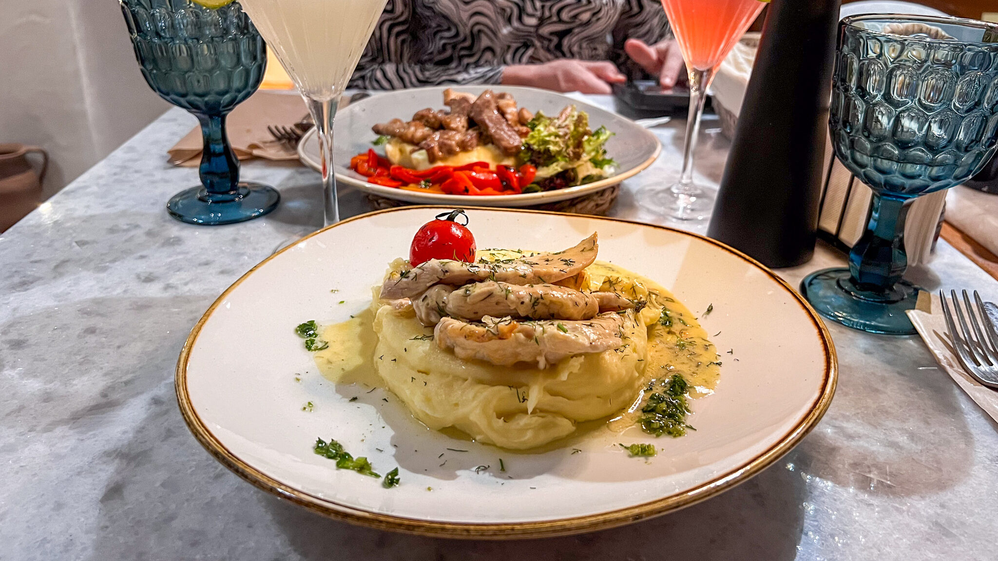 Plate of mashed potatoes and chicken.