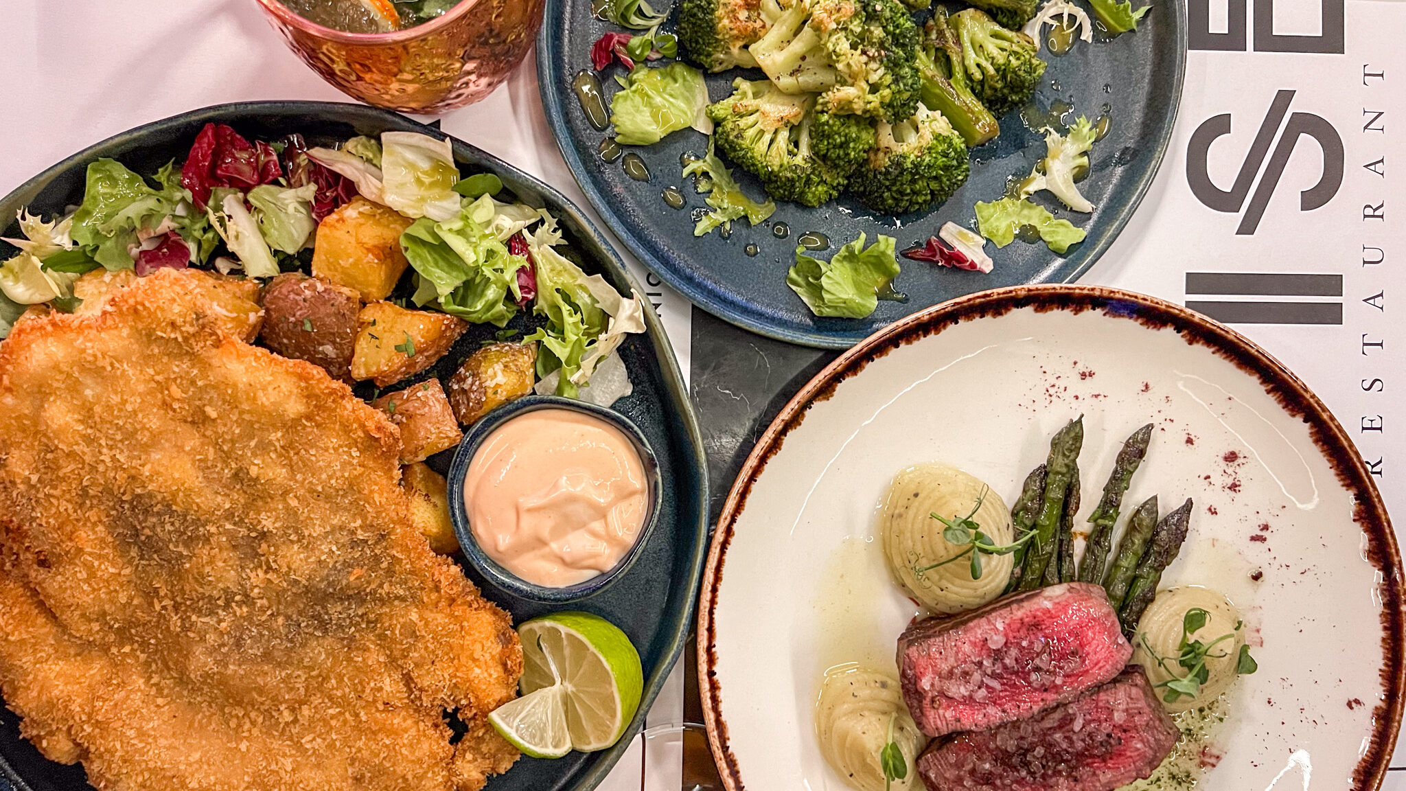 Pork schnitzel and beef fillet with greens.