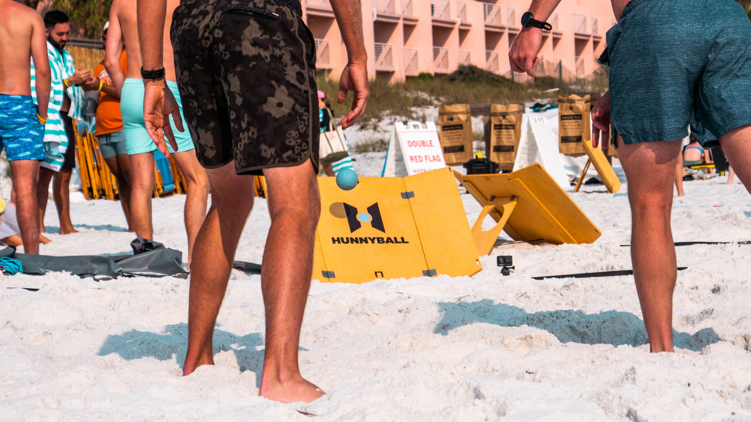 Beach game with wooden board and rubber balls.