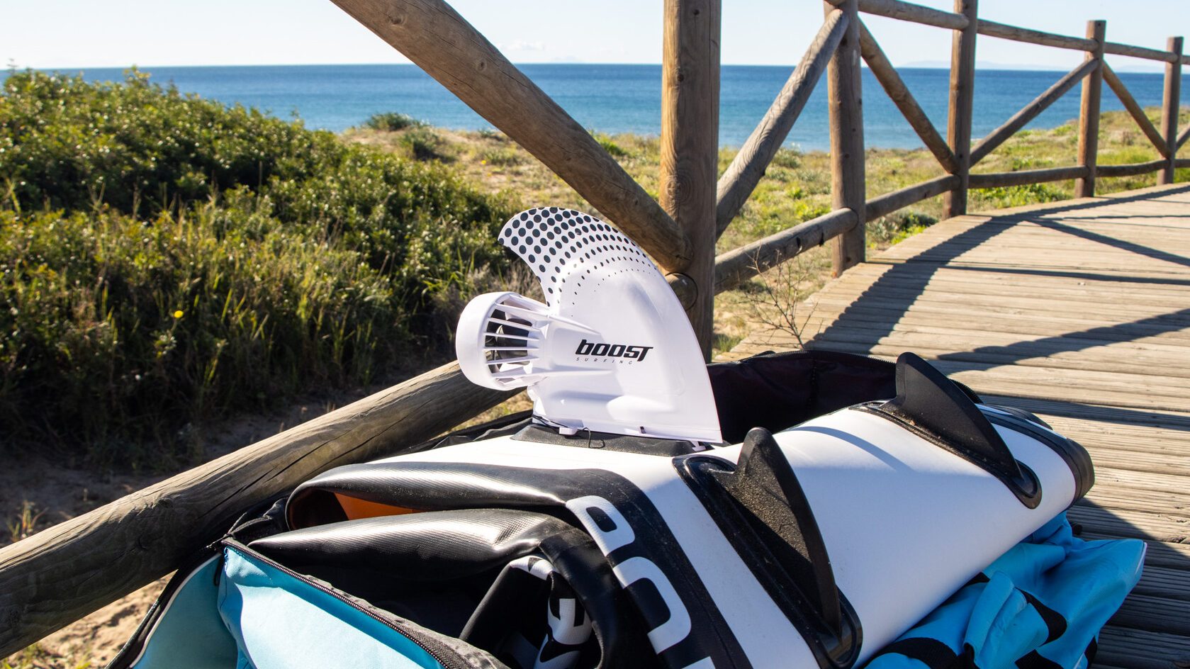 Electric paddle board motor at beach.