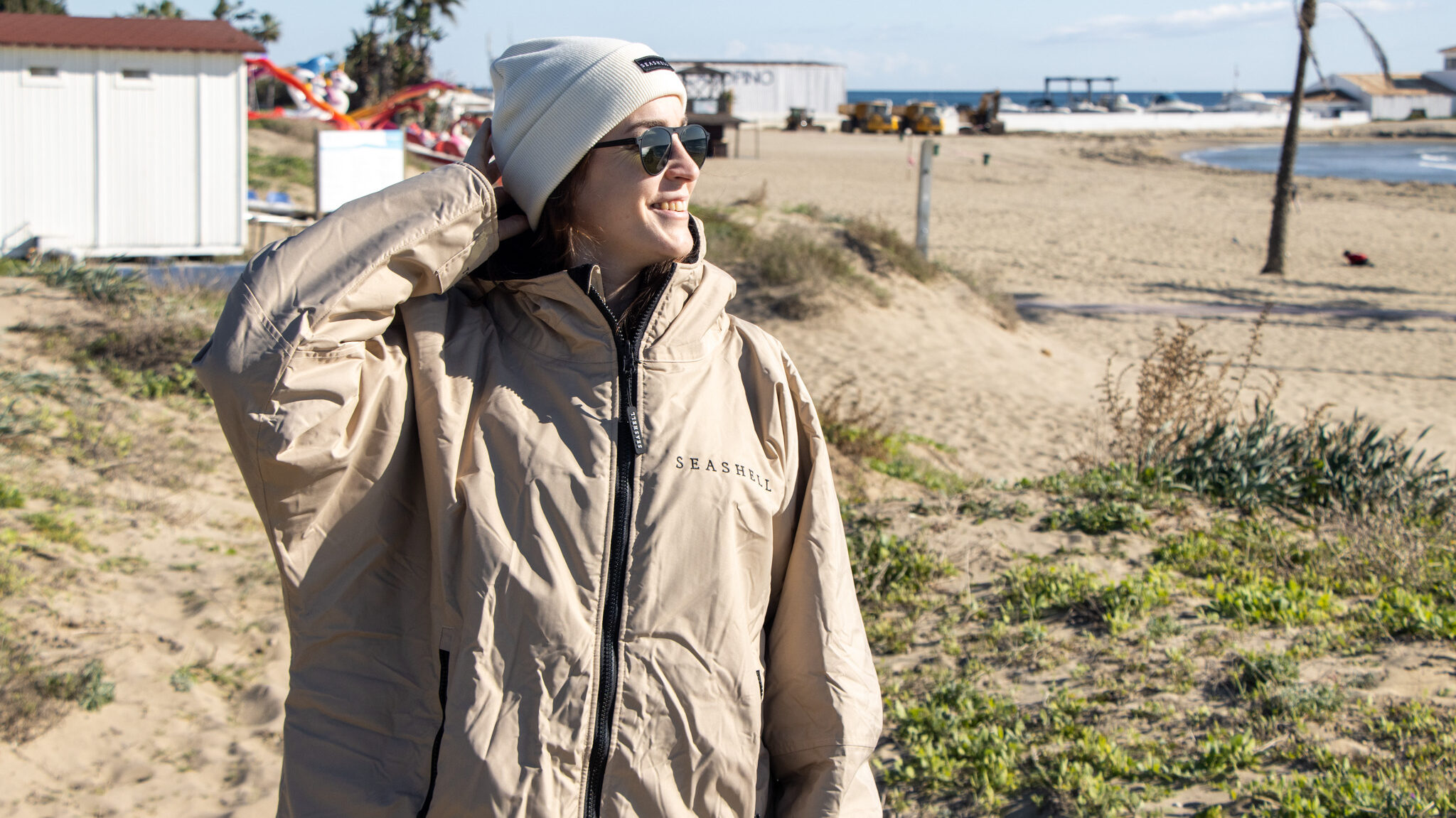 Beige changing robe with merino wool hat.